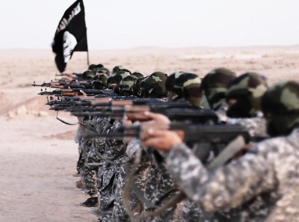  Islamic State of Iraq and the Levant propaganda photo showing masked militants firing weapons