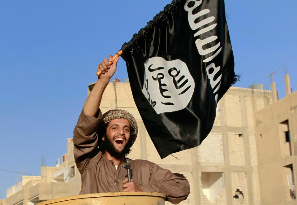  An ISIS fighter during a military parade in Raqqa province in Syria in 2014