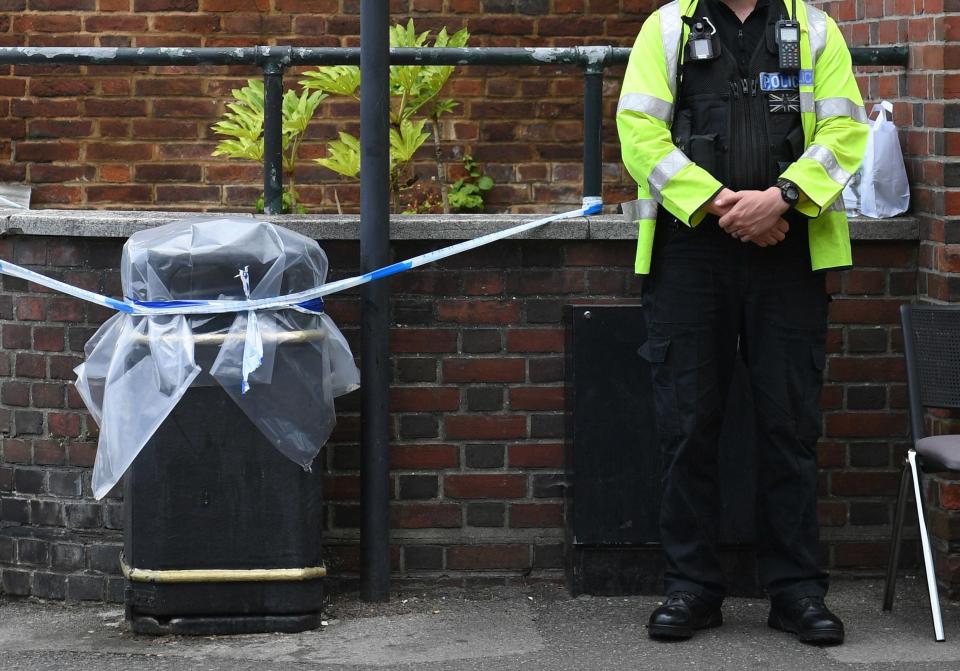  A police officer standing by a sealed off litter bin in Salisbury