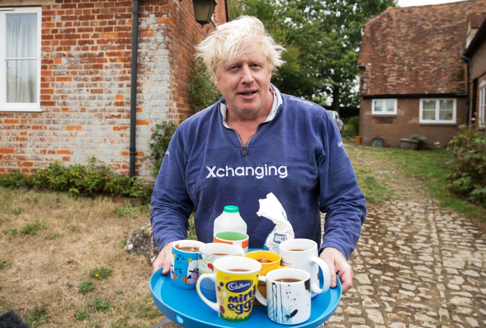 Boris offers tea to the press outside his £1m estate in Thame, Oxfordshire