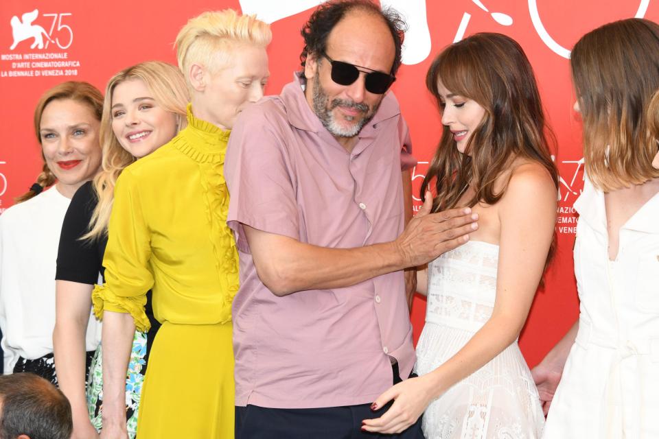  The director of Dakota's new film Suspiria appeared to place his hand on the actress' breast