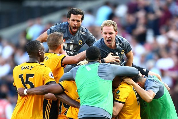 Wolves players celebrate their last-minute winner at the London Stadium