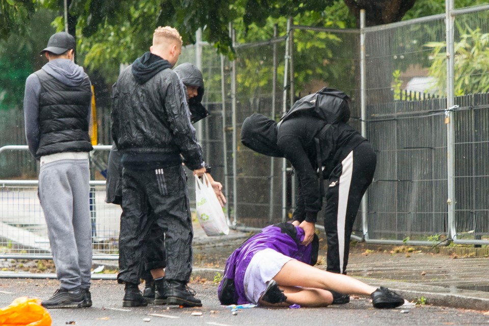 The model and his friends helped pull her up to her feet