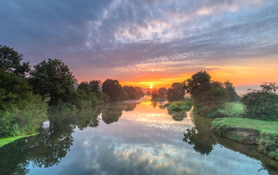  A glorious sunrise at Eye Bridge over the The River Stour, Wimborne, Dorset