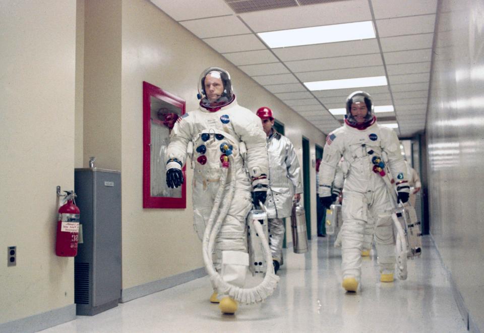 Neil Armstrong leading Michael Collins and Edwin Buzz Aldrin (hidden behind Collins) during training for the Apollo 11 mission