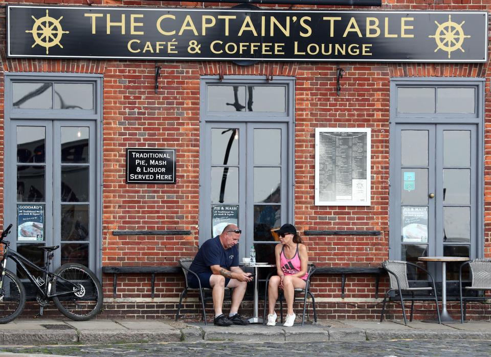  A couple relax during the warm weather in Folkestone, Kent