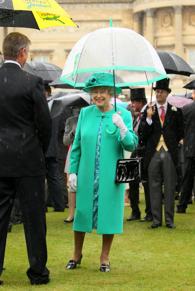  The Queen perfectly matched her umbrella with her vivid green ensemble back in July 2011