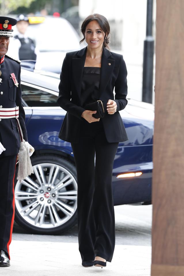  Meghan's beautiful fitted blazer and flared trousers are by New York designer Altuzarra