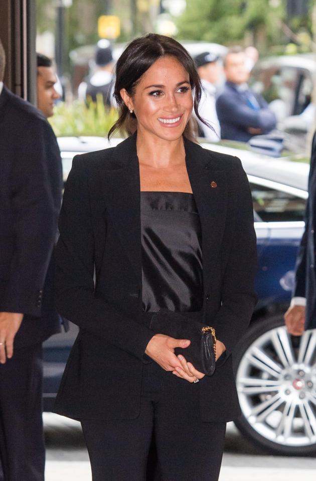  Meghan's strappy silk blouse is by Swedish designer Deitas... and costs £295