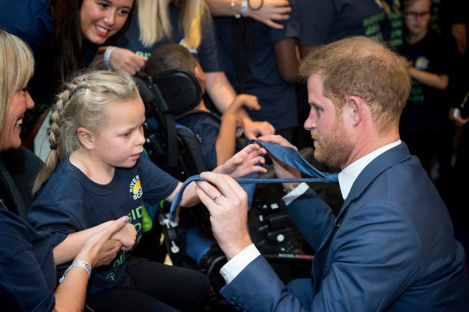  He even let one sick kid play with his tie