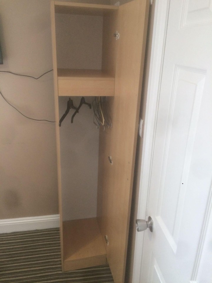 The tiny wardrobe at the hotel where the spies hid out before the attack