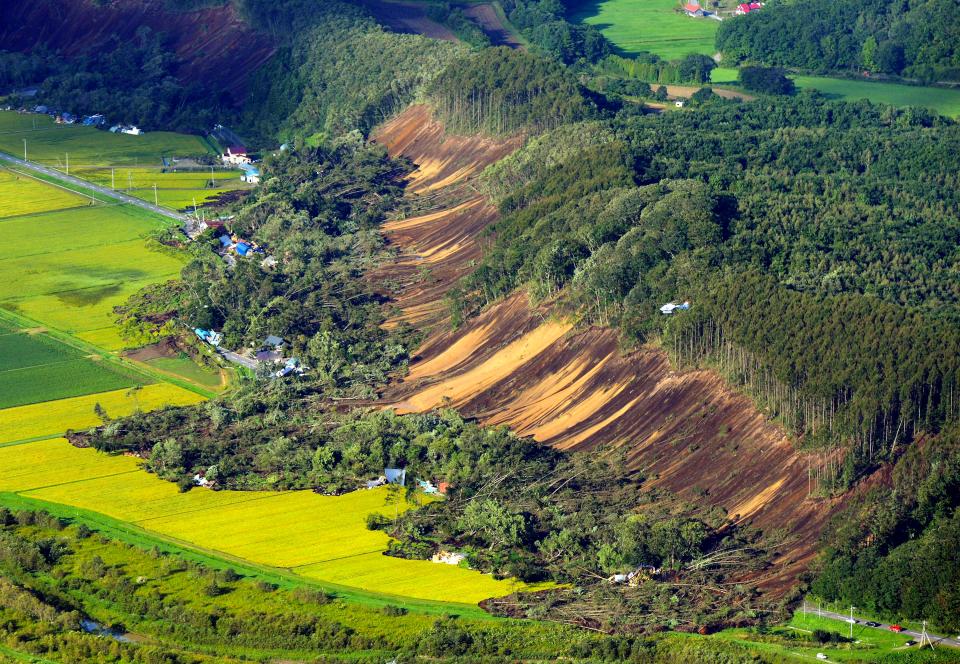 The powerful earthquake triggered deadly landslides that destroyed dozens of homes