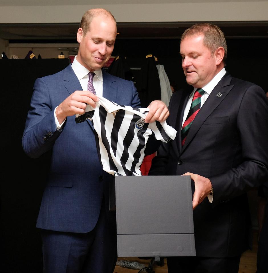  The Duke couldn't help but playfully grimace at the football shirt