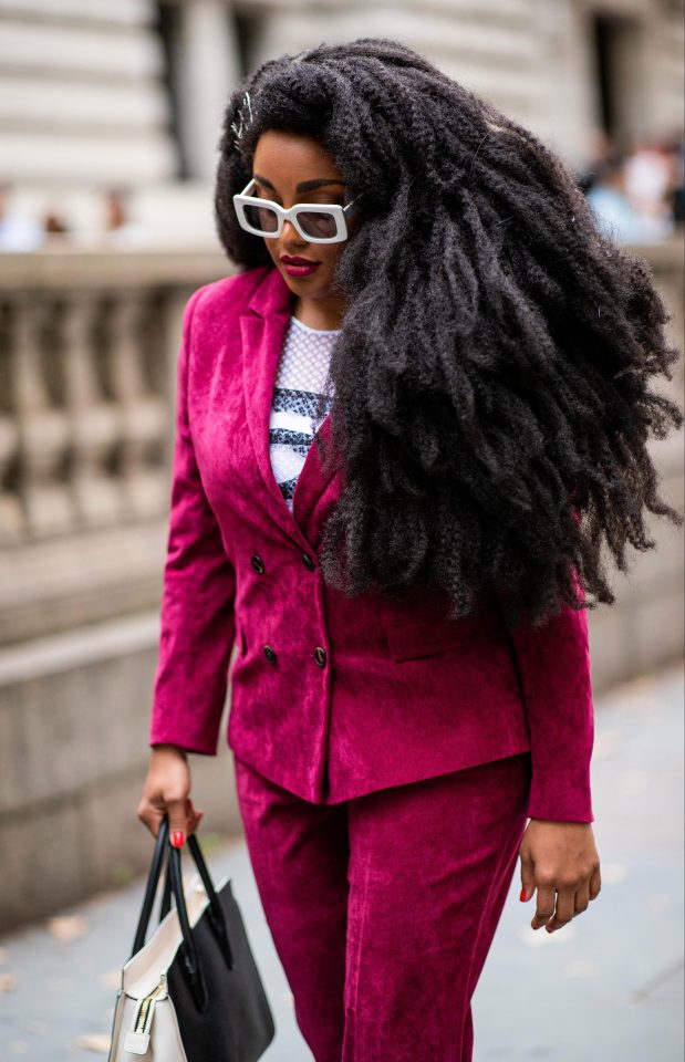  This guest opted for big hair and a bright pink velvet suit to attend the Kate Spade show