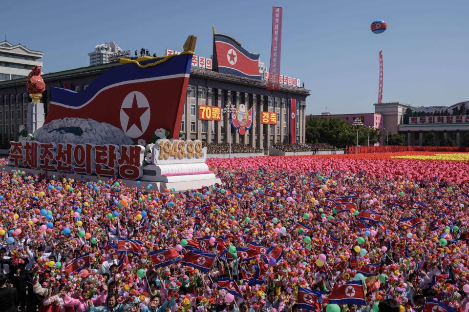 Tens of thousands of citizens pack the streets of Pyongyang to witness the spectacle