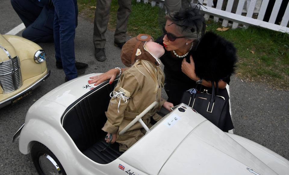  A confident racer leans over to kiss his mum before the race begins