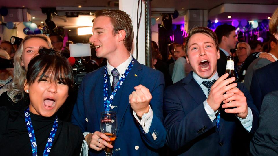  Swedish Democrats supporters react during the exit polls in Stockholm