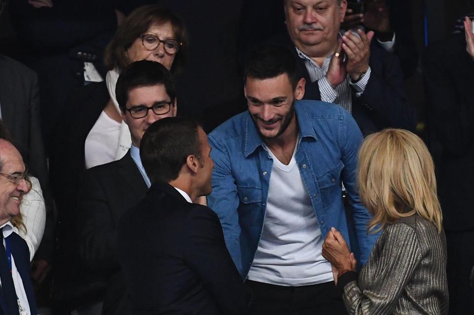  Lloris shakes hands with French president Macron during the game