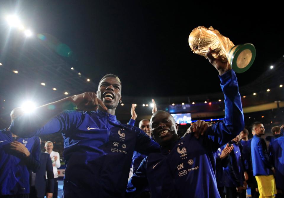  Paul Pogba, left, and team-mates celebrate on a night to remember in Paris