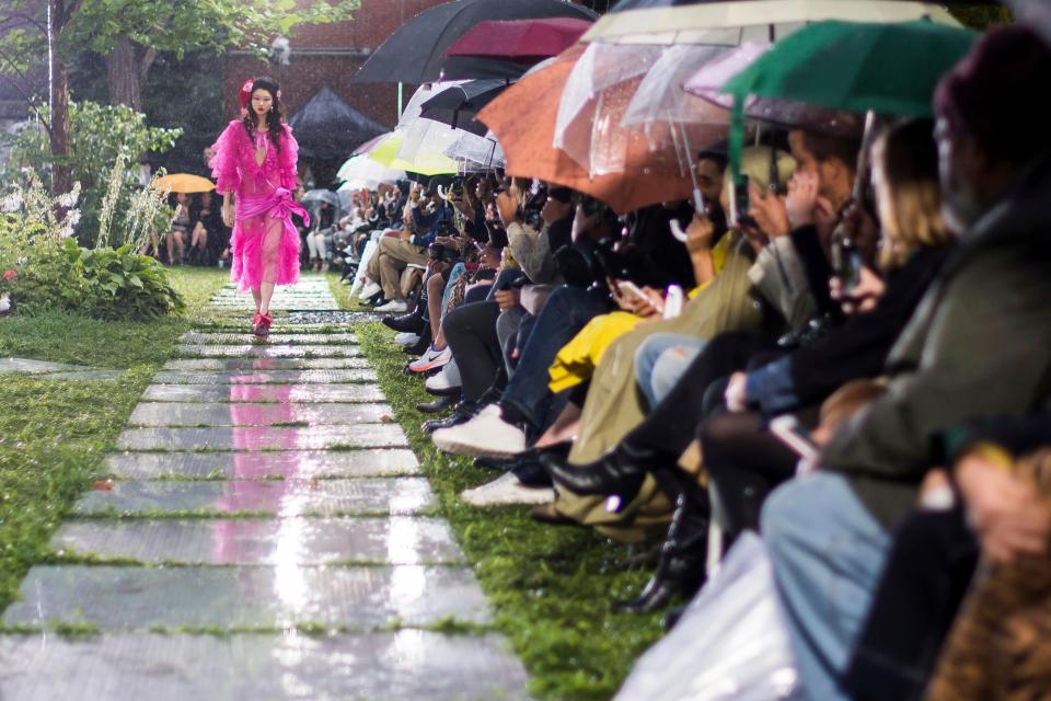  Those lucky enough to bag a front row seat at Rodarte's show had to whip out the brollies