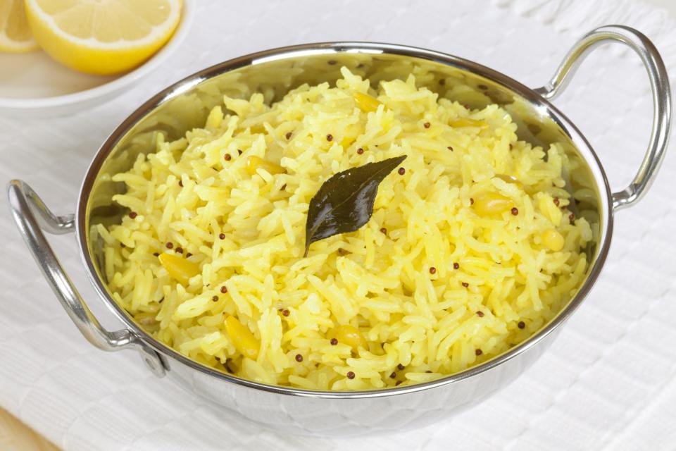  Add colour by ­mixing about an eighth teaspoon of turmeric with a tablespoon of water, then add a handful of some still hot rice to your mixture