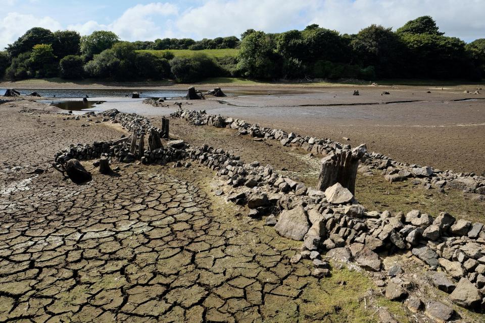  Roads, walls and gateposts have emerged from the depths at Drift Reservoir after the summer heatwave