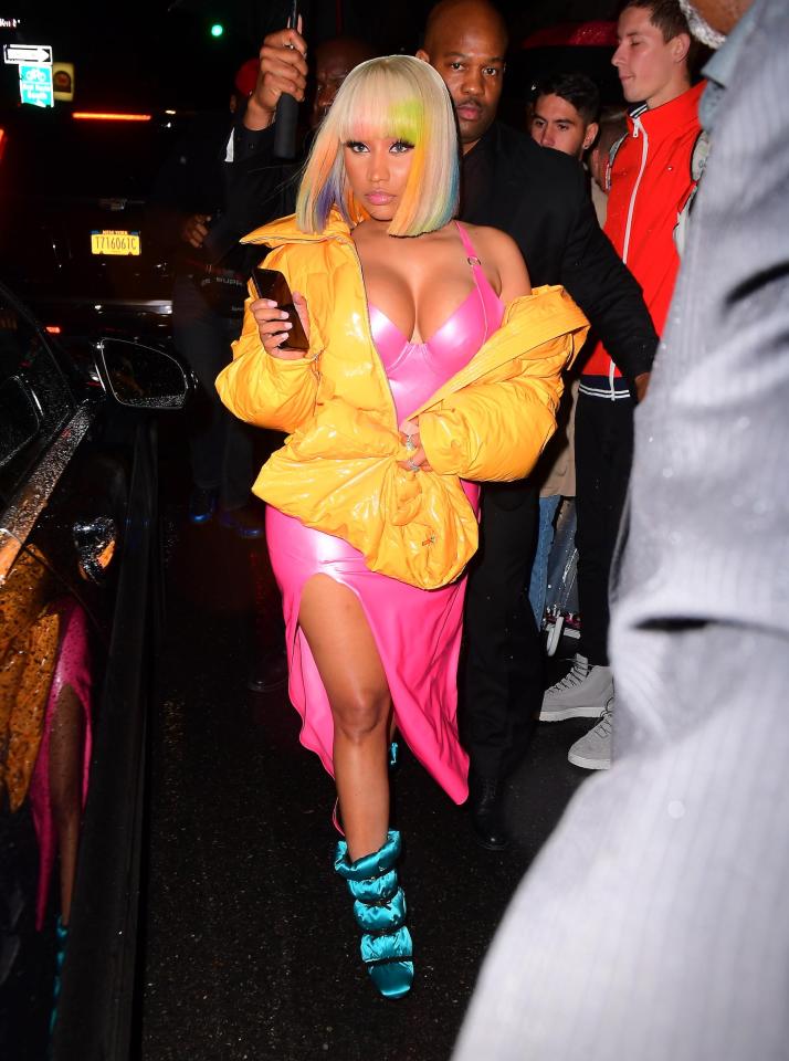  Fresh from her bust-up with Cardi B, Nicki Minaj rocked a skin-tight bright pink dress for the occasion