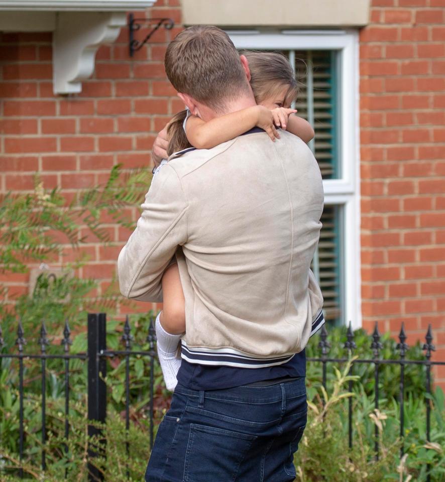  Ella and Jacqueline looked so happy to see Dan home