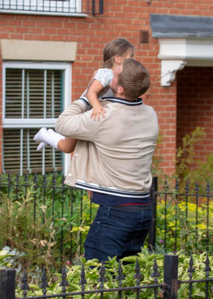  He swept his daughter Ella into his arms