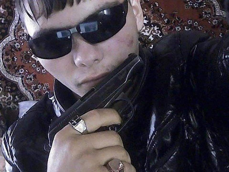  This lad's surely got everything; the gun, the jewellery, the glasses, the dignity...