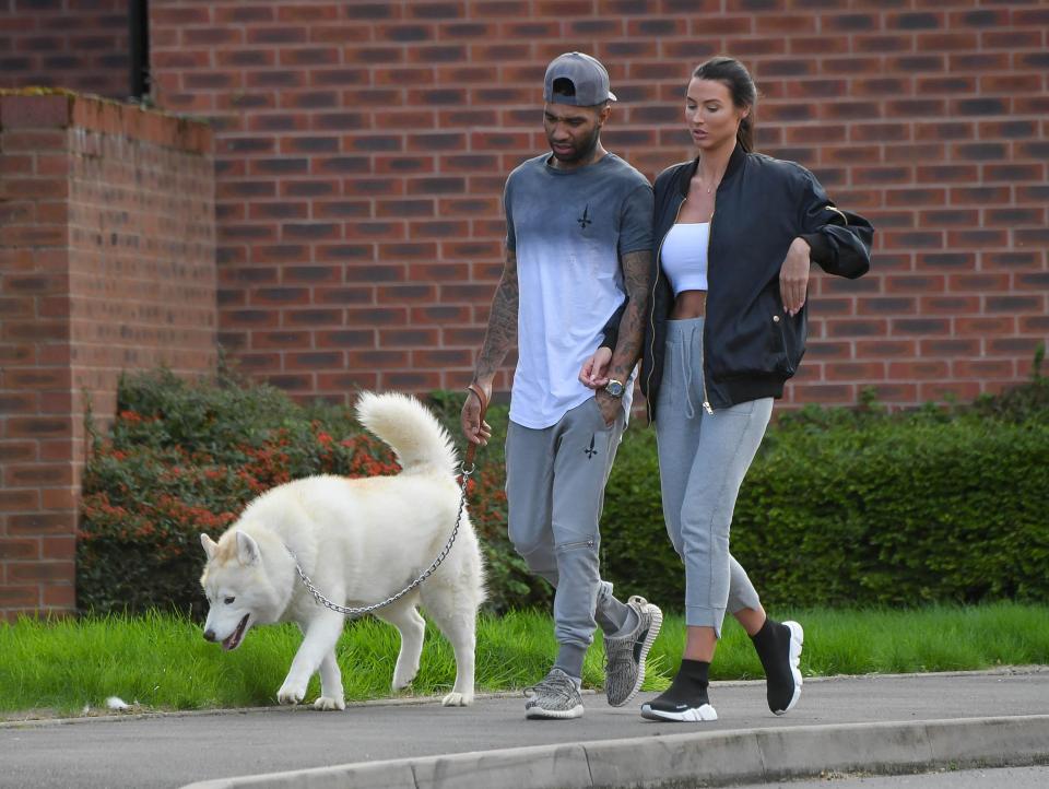  The couple locked arms as they stepped out close to their home