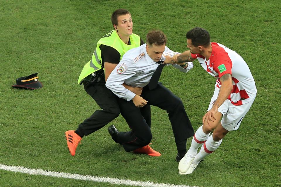  Security ran onto the pitch and tackled the Pussy Riot invader to the ground