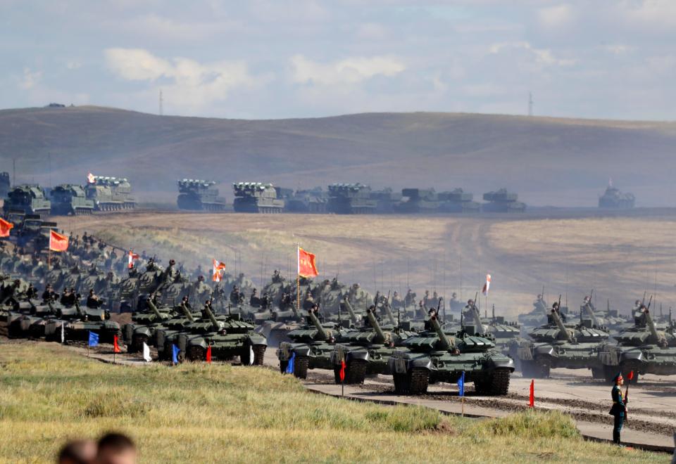  Chinese tanks roll across the fields during military exercises at Tsugol in eastern Siberia