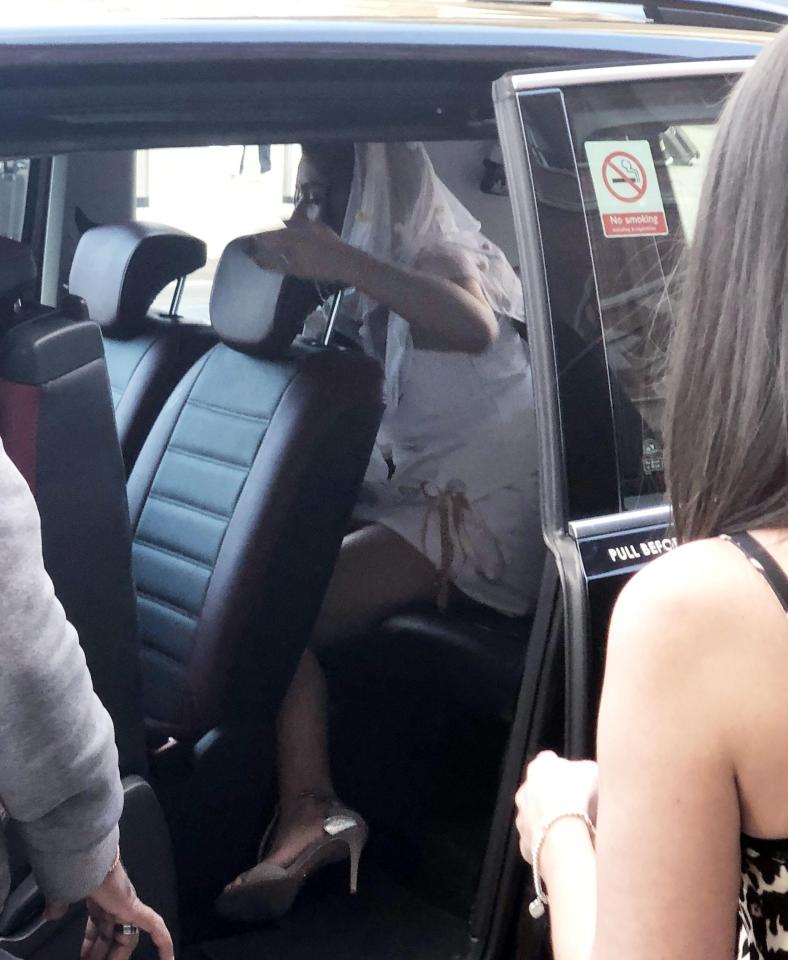  The star was seen getting in a cab with friends in a white dress