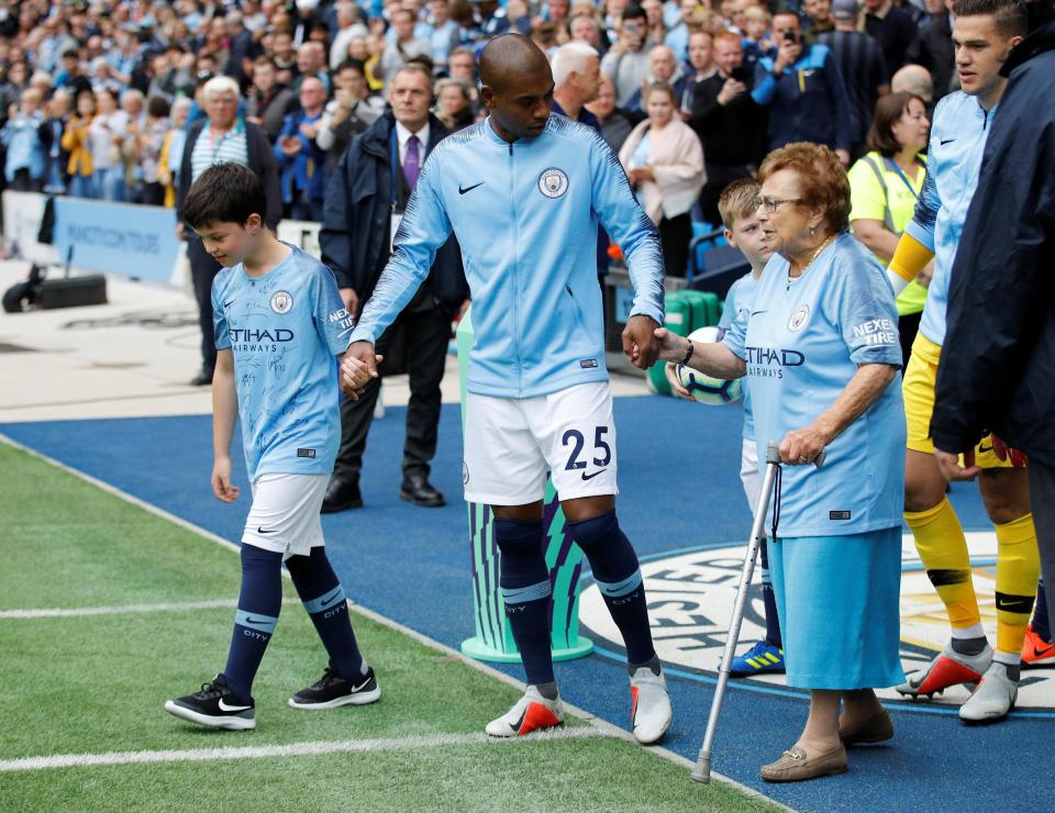  Olga Halon, 97, accompanied Manchester City midfielder Fernandinho on to the pitch