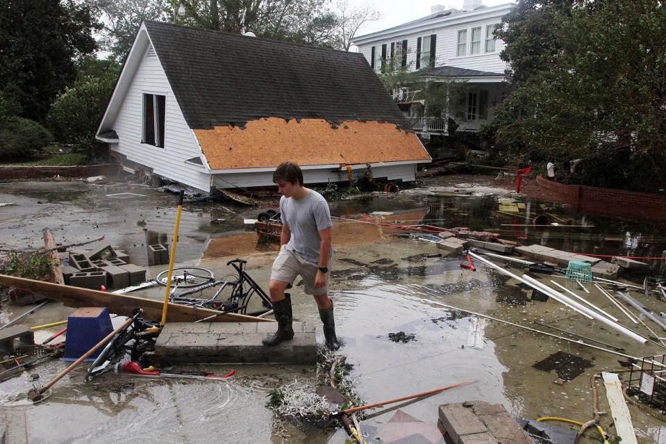  Resident Joseph Eudi looks at flood debris and storm damage from Hurricane Florence at a home on East Front Street in New Bern