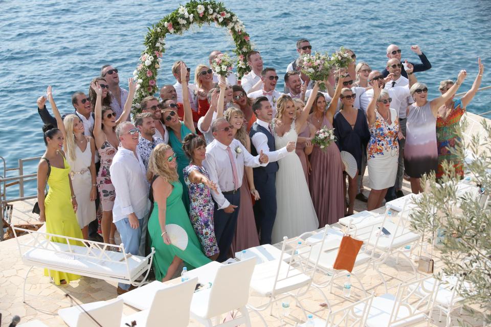  Wedding guests all smile for the cameras on romantic day