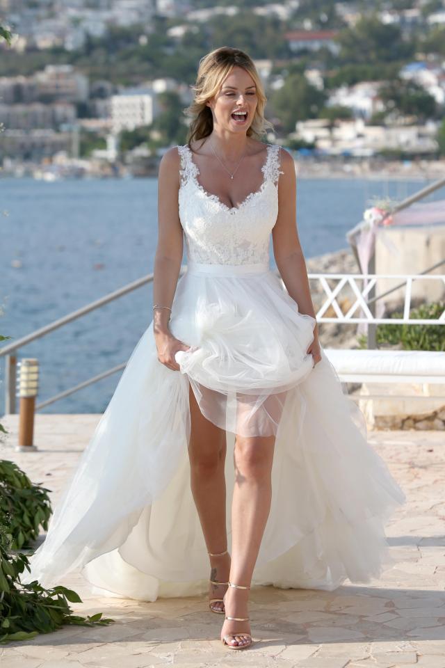  Rhian Sugden wows as she walks down the aisle in a floor-length white gown