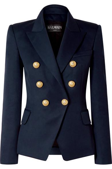 The navy Balmain jacket costs £1,495 and has double-breasted golden buttons down the front