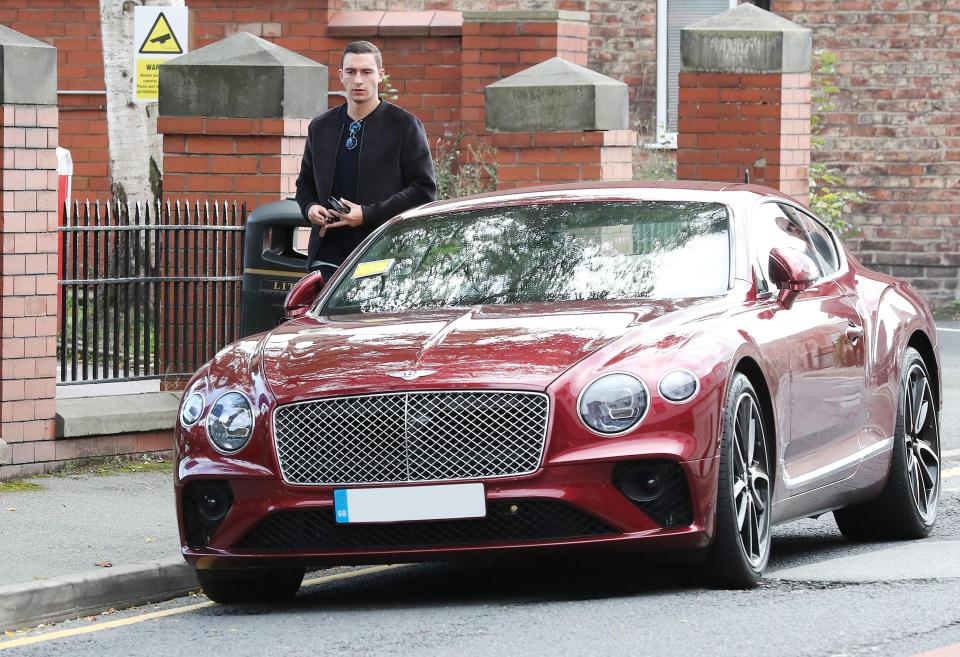  Darmian cut a frustrated figure when returning to his vehicle in Wilmslow town centre