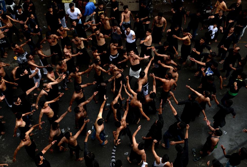 Indian Shia Muslim beat their chests during the religious procession on the sixth day 