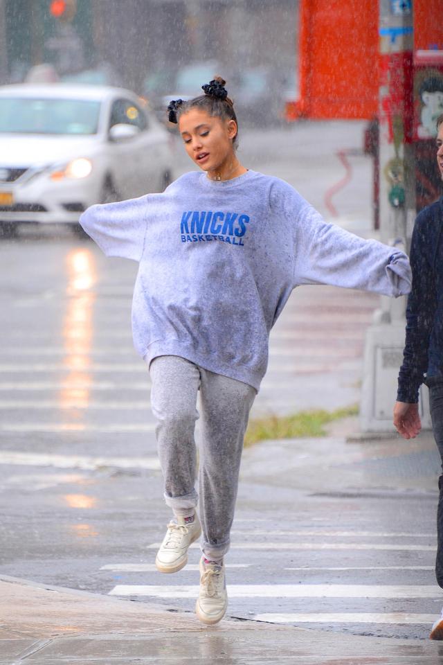  Yesterday Ariana danced in the rain as she stepped out with pals in the city