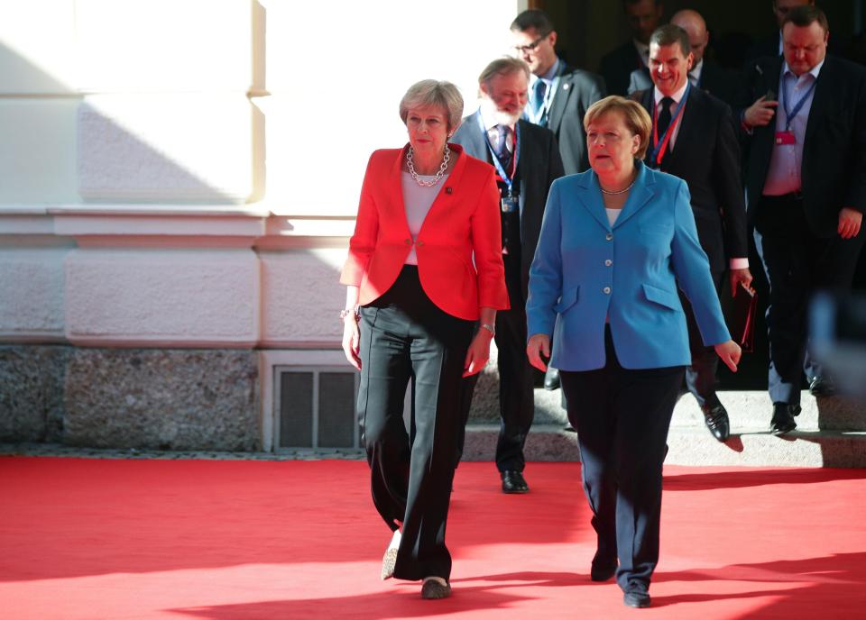  Mrs May chatted with Angela Merkel on the sidelines of the meeting