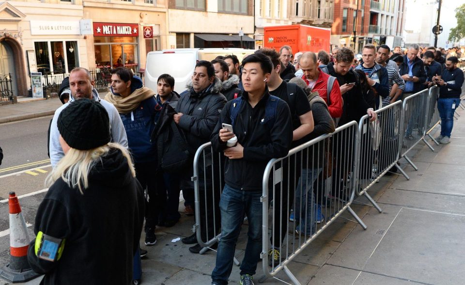  Customers queue outside the Apple Store in Regent Street