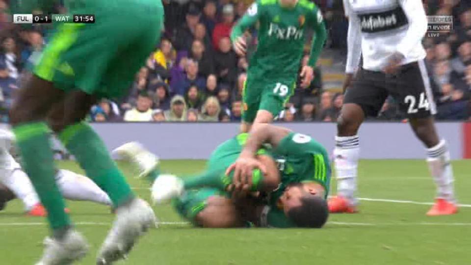  Deeney was left clutching his leg