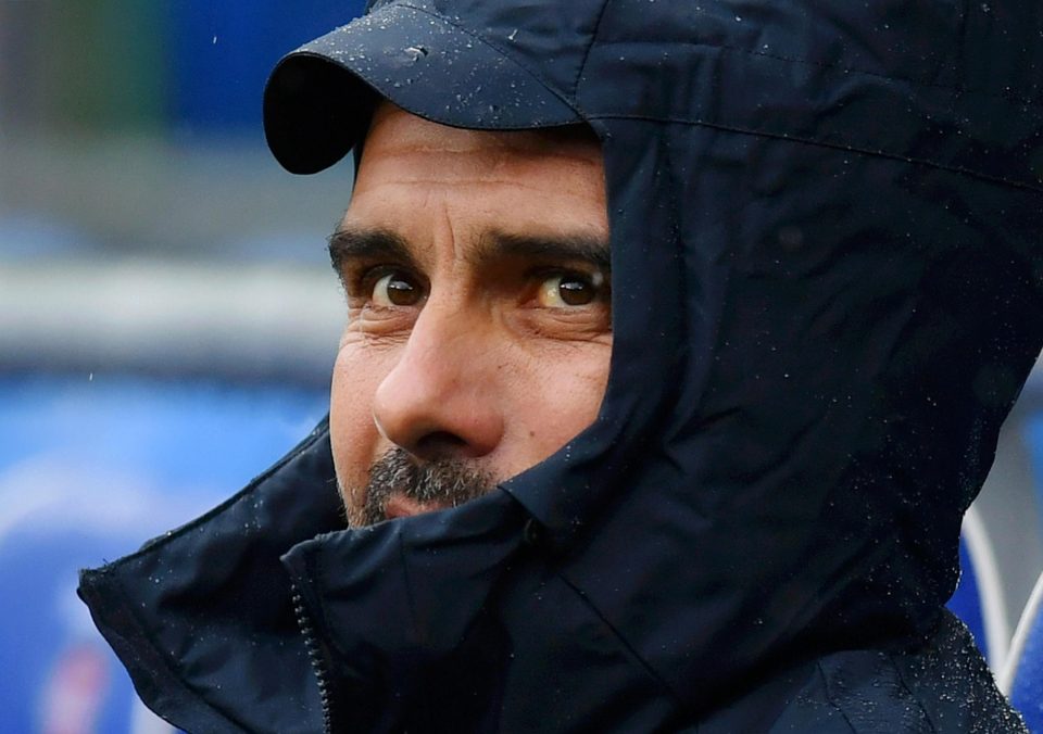  Pep Guardiola keeps dry from the South Wales rain