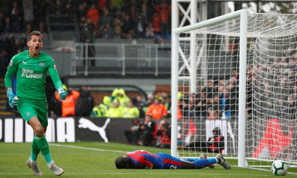  A distraught Sakho, right, reacts in disbelief after his miss against Newcastle