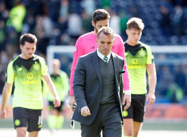 Brendan Rodgers and his players trudge off the field after another shock defeat