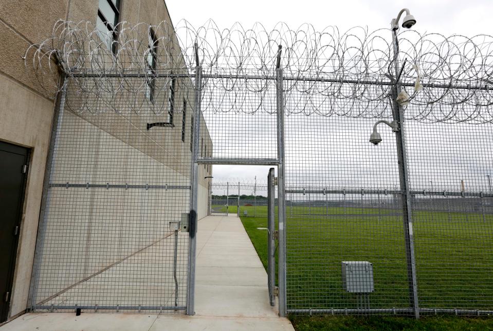  The high-secure state prison is surrounded by fences topped with razor wire