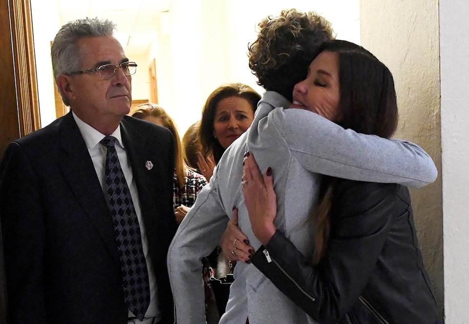  Janice and her fellow accuser Andrea embrace after the sentencing